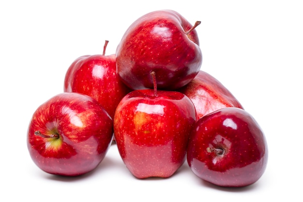 Close up view of some red apples isolated on a white background.