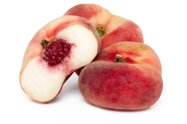 Close up view of tasty paraguayo peaches isolated on a white background.