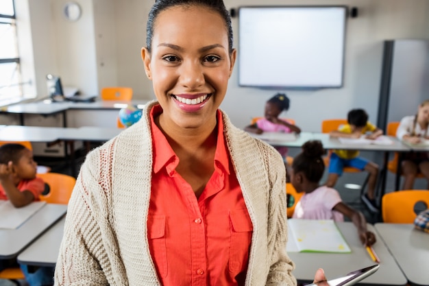 Close up view of a teacher standing and posing