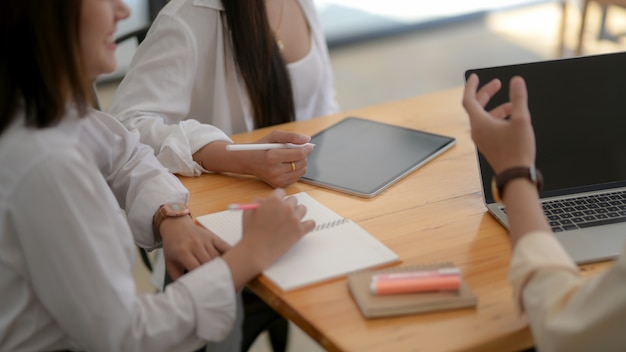 Close up view of university students group discussing on their assignment