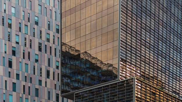 A close-up view of urban facades made of crystal and bricks