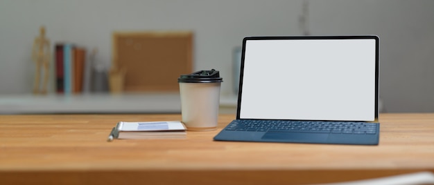 Close up view of workspace with laptop