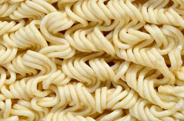 Close up view of yellow dry instant noodles. Chinese traditional food