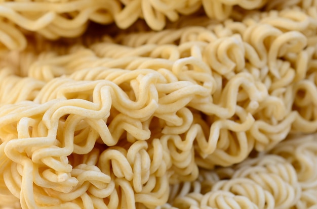 Close up view of yellow dry instant noodles. Chinese traditional food