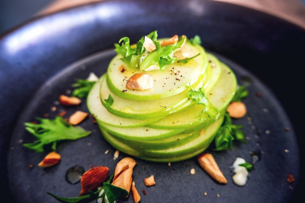 Close up waldrof salad in white plate on wood