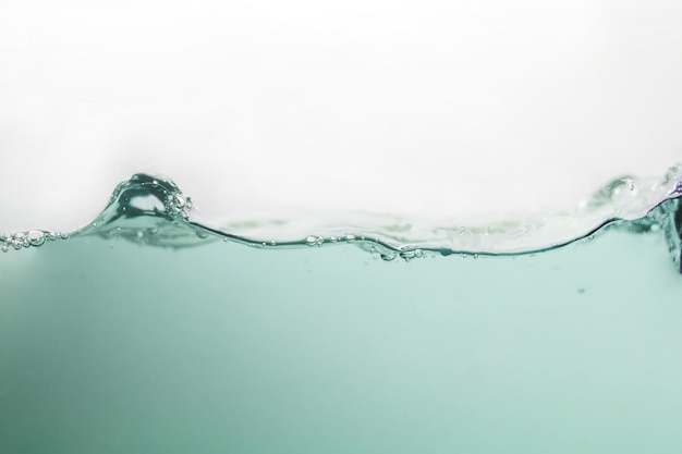 Close up water waves and bubbles on background