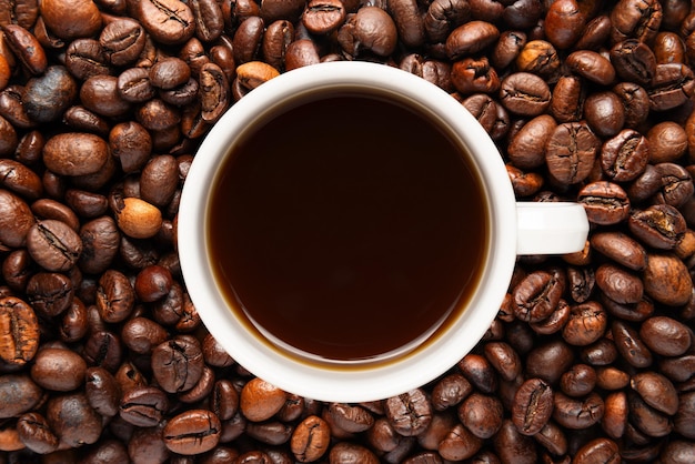 Close up White Cup Roasted Coffee Beans Background