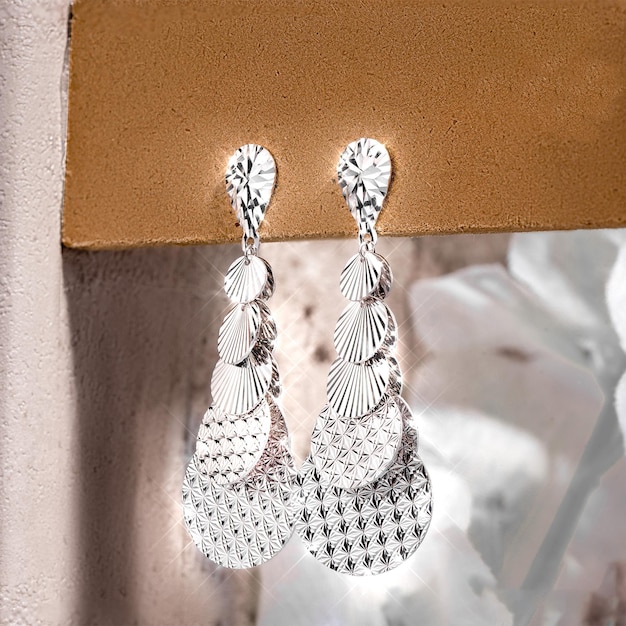 Close-up white gold stud earrings, with white crystals and diamonds. Women Accessories