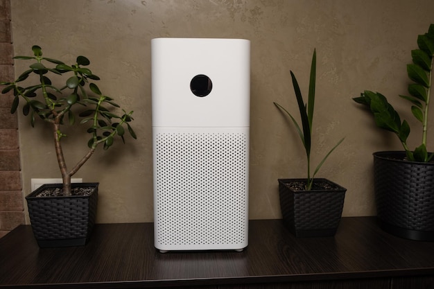 Close-up of a white indoor air purifier. Dust and allergy cleaner in the house.