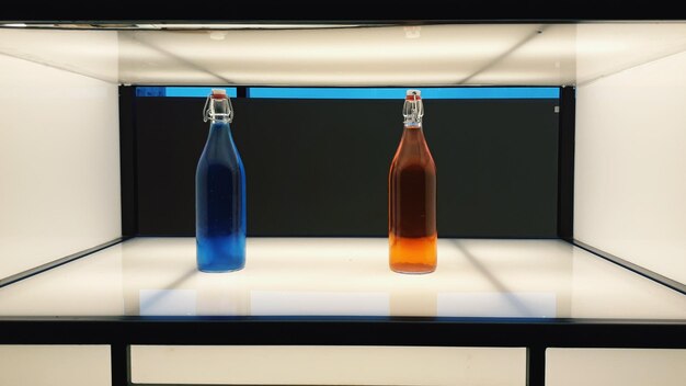 Photo close-up of wine bottles on table against wall