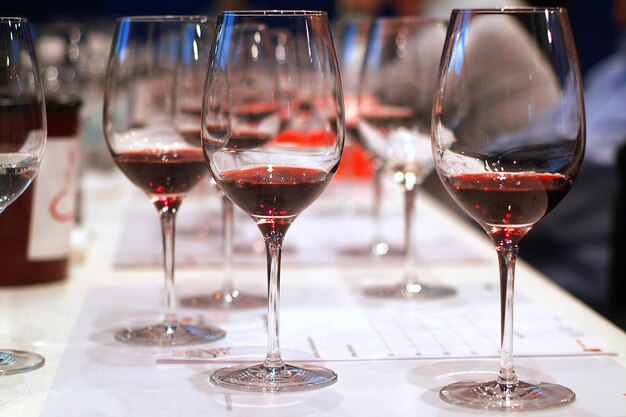 Close-up of wine glasses on table