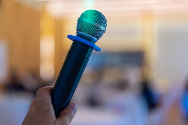 Close up wireless mic in the seminar classroom with blur students behind