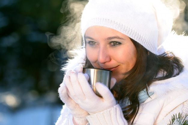 Close-up of woman drinking hot drink