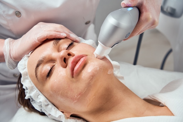 Close-up Of Woman Getting Facial Hydro Microdermabrasion Peeling Treatment