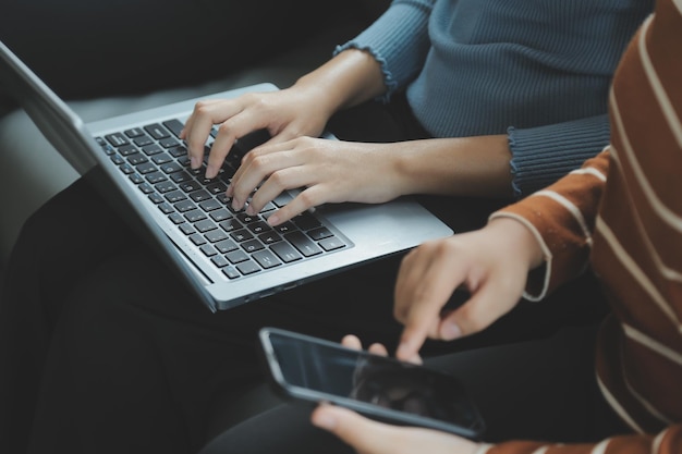 Close up of woman hand using credit card and laptop for payment and online shopping Online shopping payments digital banking Ecommerce concept