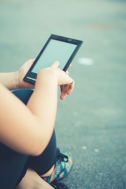 close up of woman hand using technological tablet device 