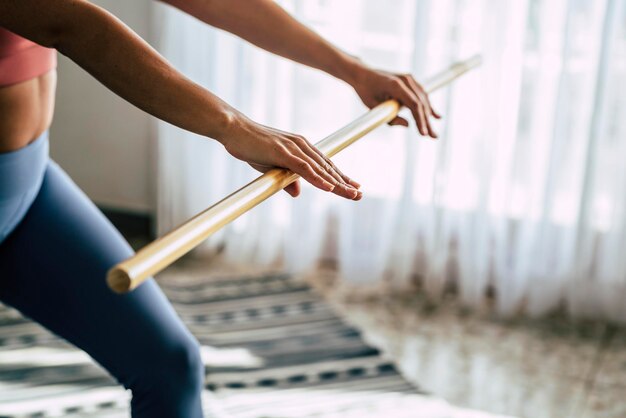 Close up of woman hands doing pilates and gym sport exercises at home for healthy care lifestyle wellbeing people goals and successful lifestyle