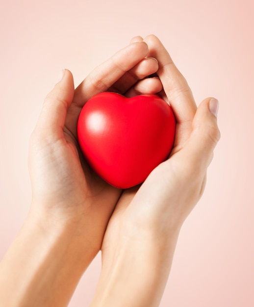 close up of woman hands with heart