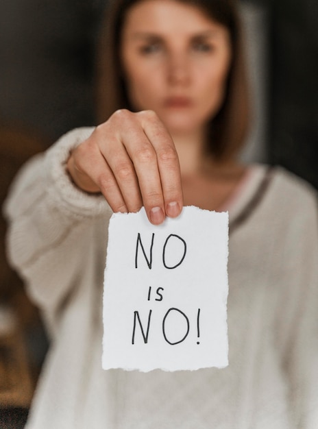 Photo close up of a woman holding an awareness message