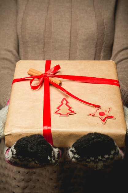 Close up on woman holding a Christmas gift