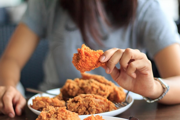 Close-up of woman holding ice cream in plate