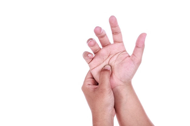 Close up woman's holding her hand isolated on white background. Hand pain concept.