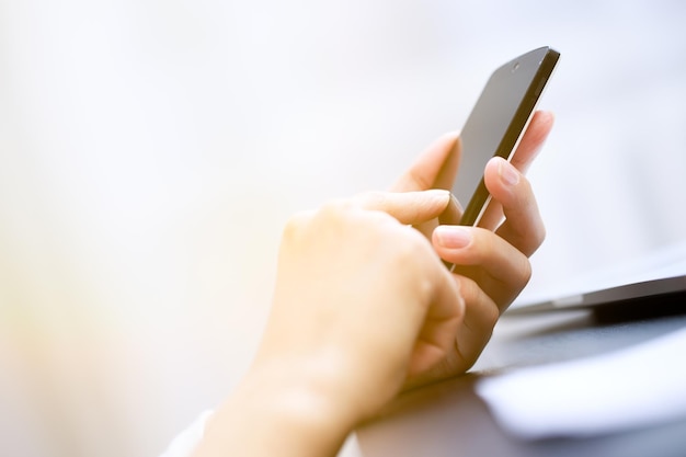 Close up of a woman using smartphone