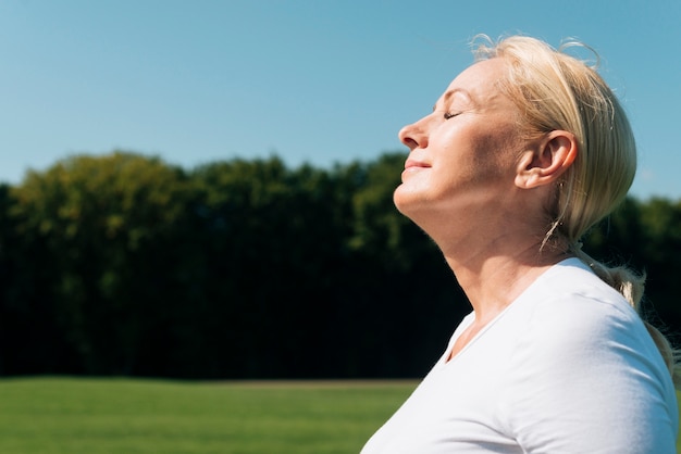 Close-up woman with closed eyes outdoors