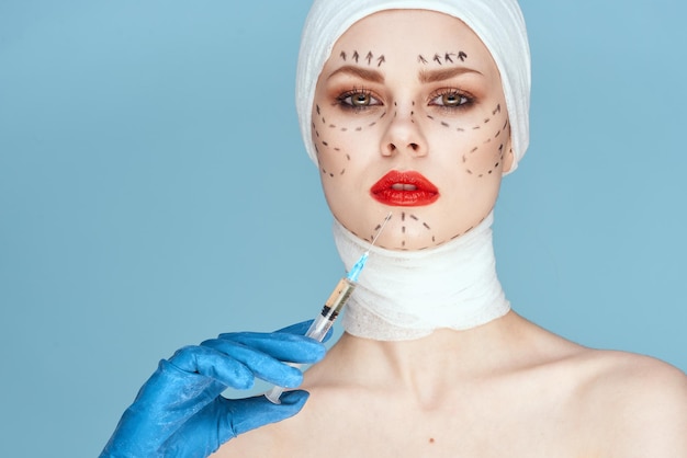 Photo close-up of woman with heart shape against blue background