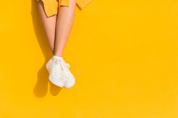 Close-up woman on yellow background