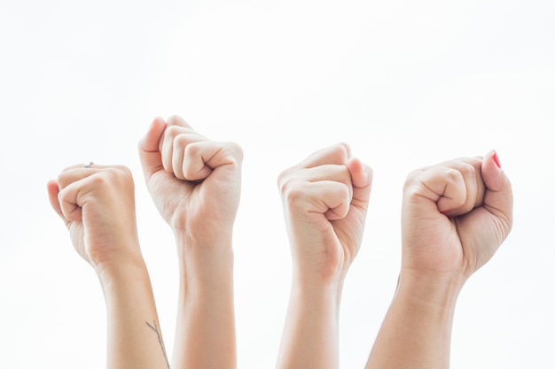 Close-up women holding fists up at protest