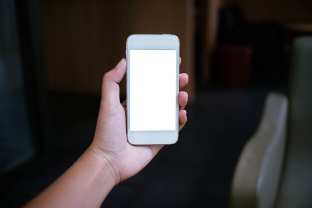 Close up of women's hands holding cell telephone blank copy space screen. smart phone with technology concept