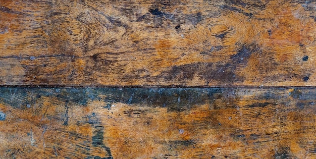 A close up of a wooden floor with a blue stain.