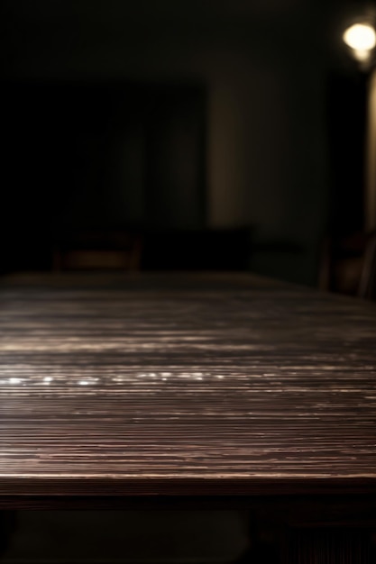 A Close Up Of A Wooden Table In A Dark Room