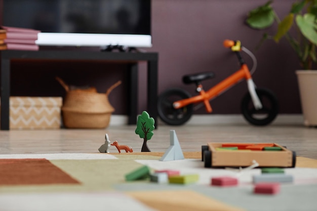 Close up wooden toy set on carpet in childrens room