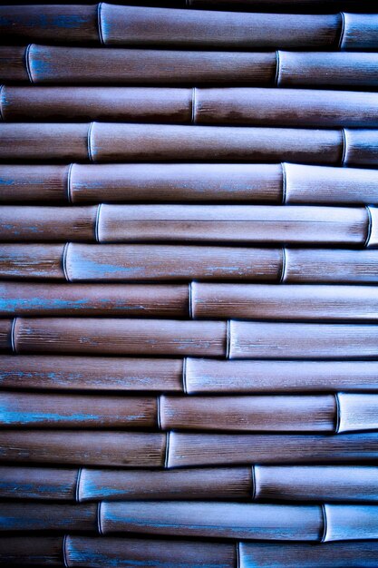 A close up of a woven basket with blue paint.