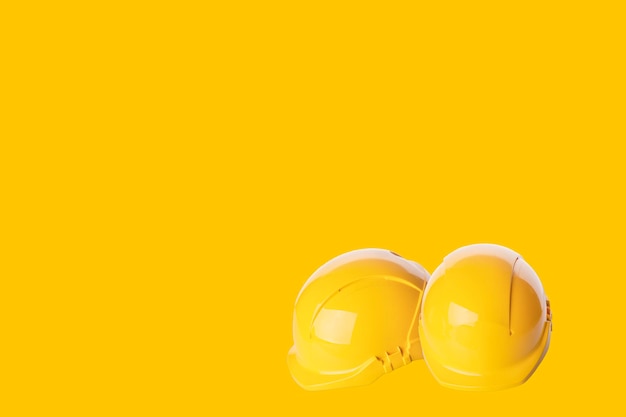 Close up of Yellow building safety helmet hard hat isolated Always use correct PPE Space for text