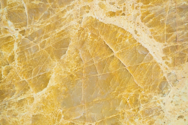 Close up of  yellow marble textured background.