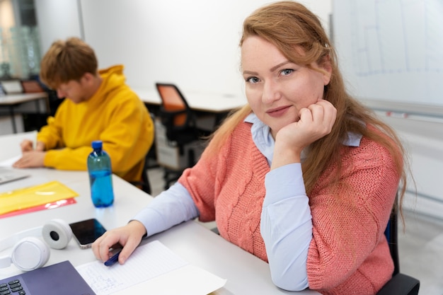 Photo close up on young adult working in office