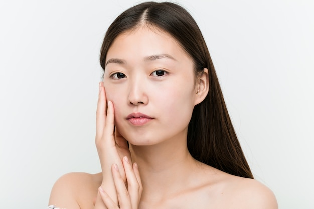 Close up of a young beautiful and natural asian woman