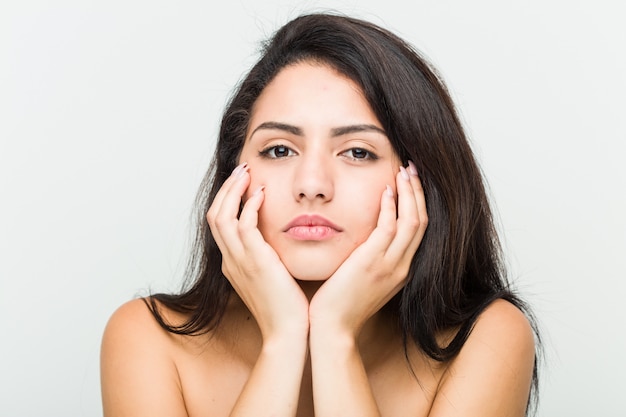 Close up of a young beautiful and natural hispanic woman