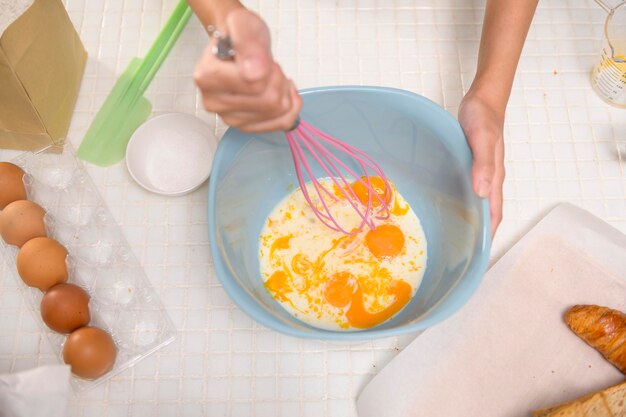 Close up of Young beautiful woman is baking in her kitchen bakery and coffee shop business