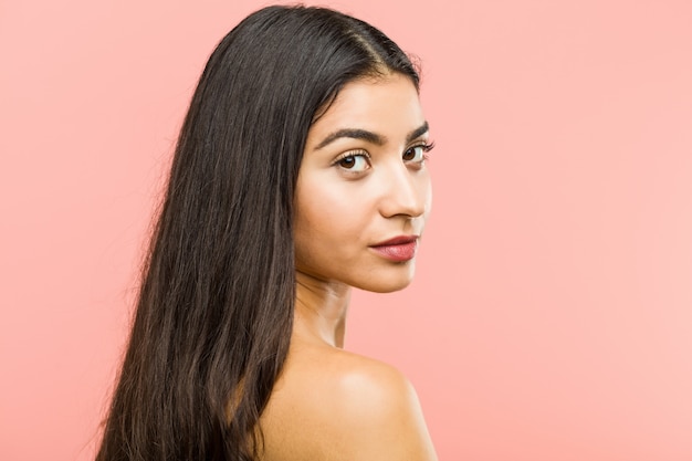 Close up of a young beauty and natural woman posing