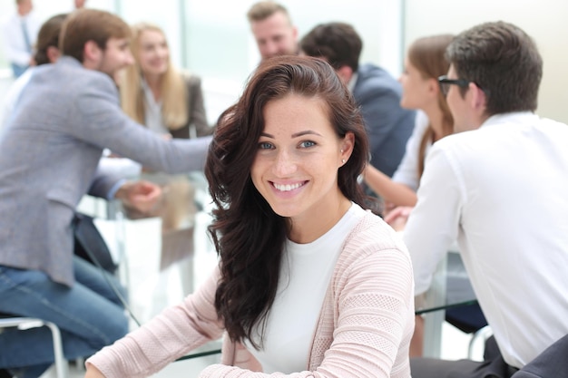 Close up young businesswoman on the background of the conference room