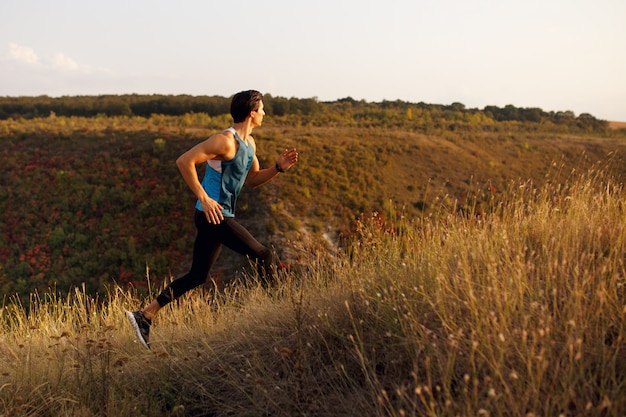 Close-up of a young man doing exercises outdoors