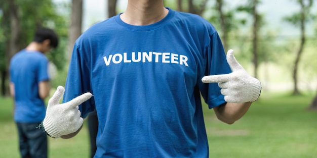 Close up young man volunteering wearing tshirt with volunteer message