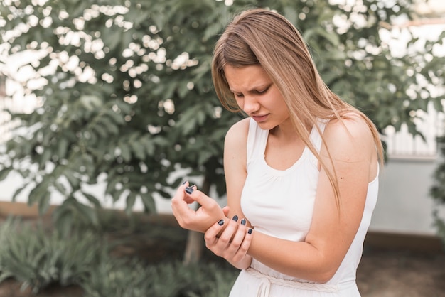 Close-up of young woman having wrist pain