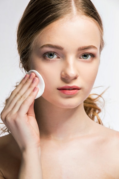 Close-up of young woman holding beauty sponge