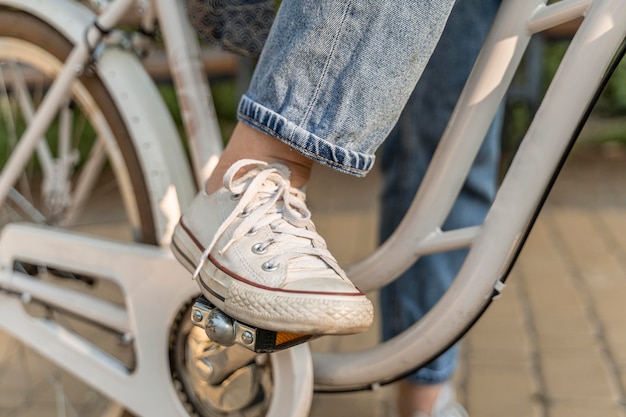 Close-up young woman riding bike