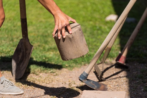 Close up of young woman's hand holding a log hard work